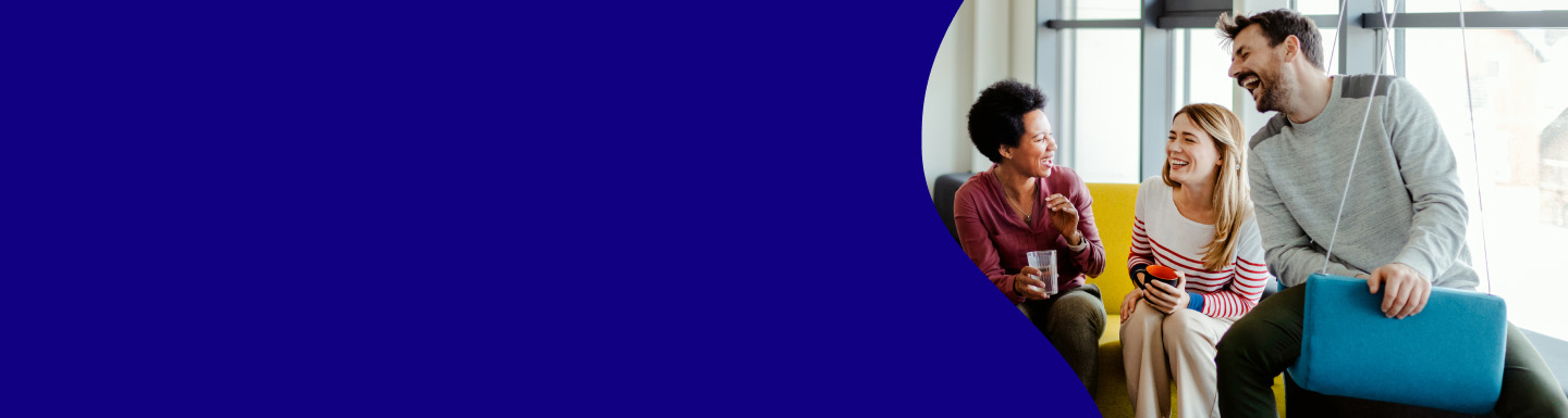 A woman looks over her shoulder in an office